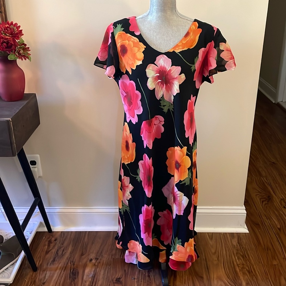 Pretty black dress with vibrant orange and pink flowers.